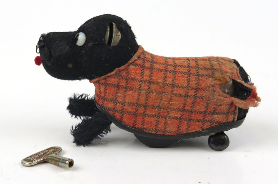 Mekanisk leksak, Schuco, 1940-50-tal, springande hund, l 13 cm, skador_25181a_8dadebc720c7e1a_lg.jpeg