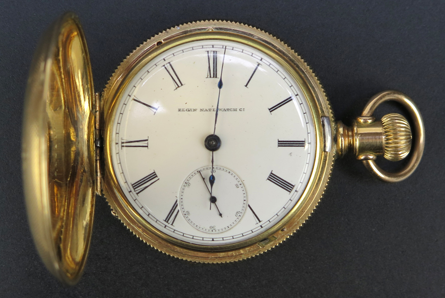 Herrsavonett, förgylld mässing, Elgin National Watch Company , USA, 1800-talets 2 hälft, Keystoneboett (originalpapper medföljer) diameter 53 mm