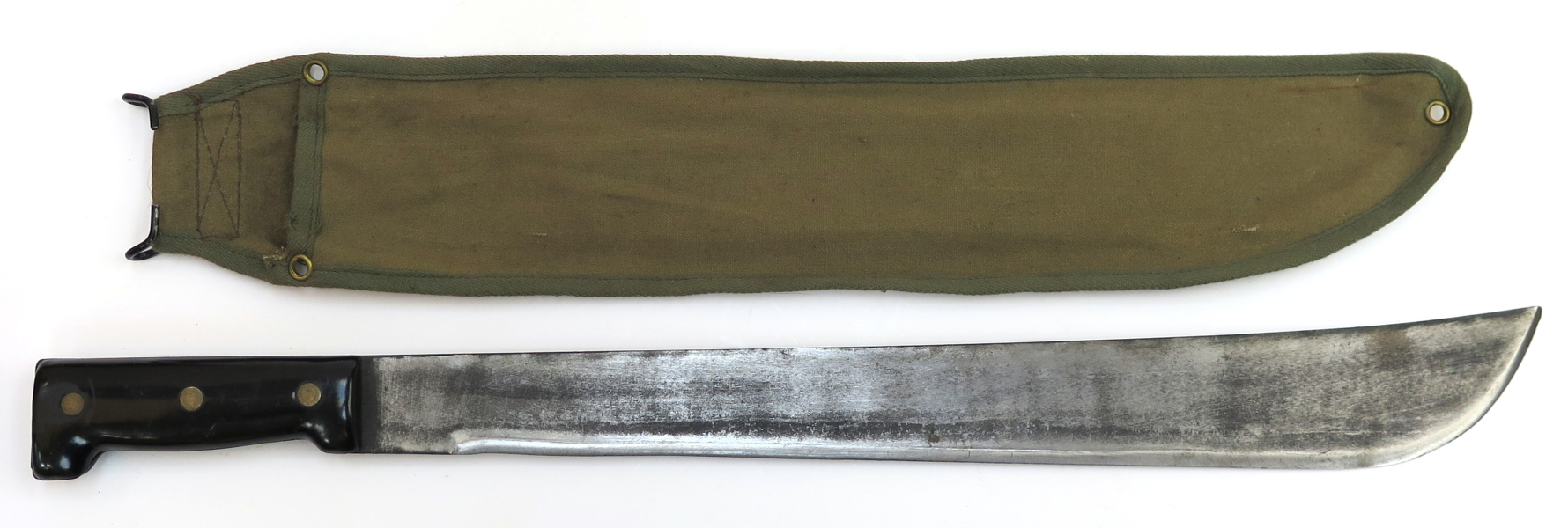 Machete i textilbalja, smide och nylon, 1900-talets mitt eller 2 hälft, längd 59 cm