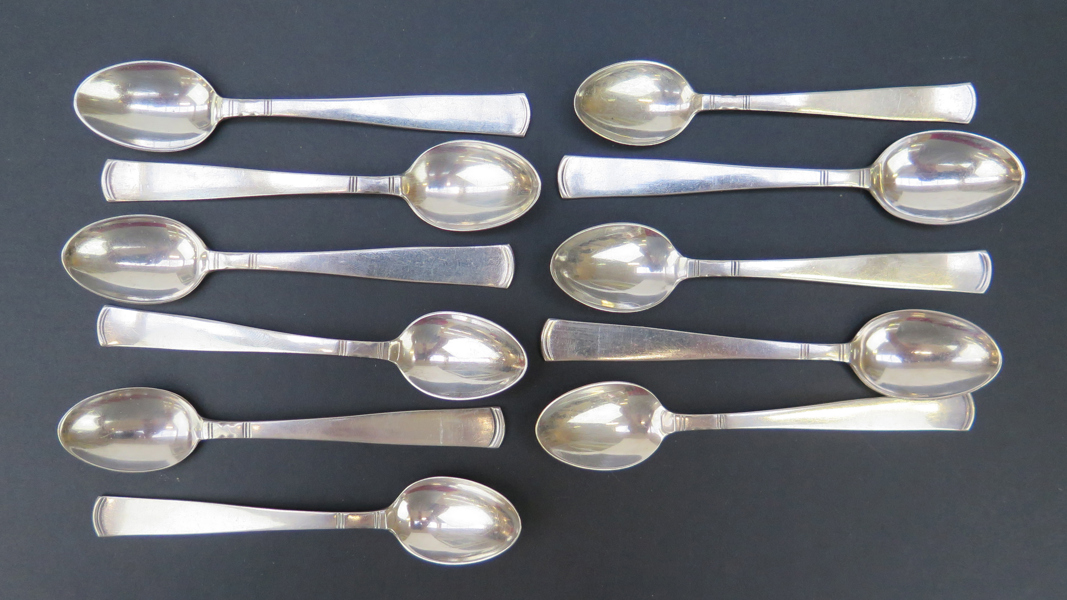 Theskedar, 10 st samt kaffesked, silver, Rosenholm, design Jakob Ängman 1933, stämplade GAB Stockholm, l 18 cm, total vikt 175 gram