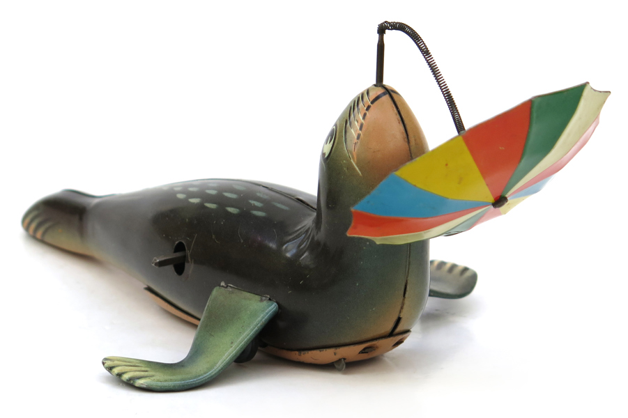 Mekanisk leksak, litograferad plåt, "Phoque Jongleur", Karl Arnold, Western Germany, l 18 cm
